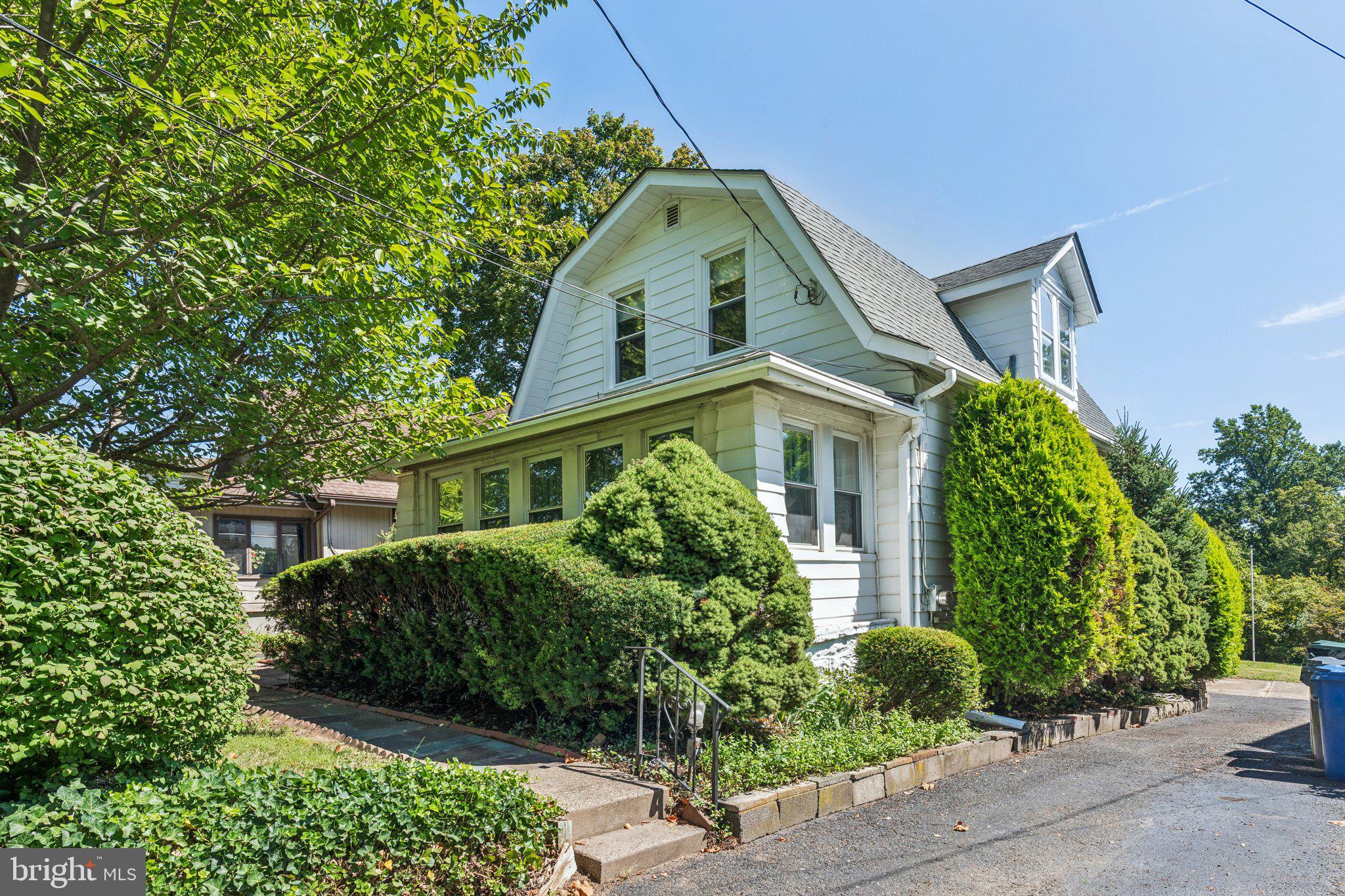 375 Church Road Jenkintown, PA 19046 - Photo 5 of 69 a front view of a house with garden