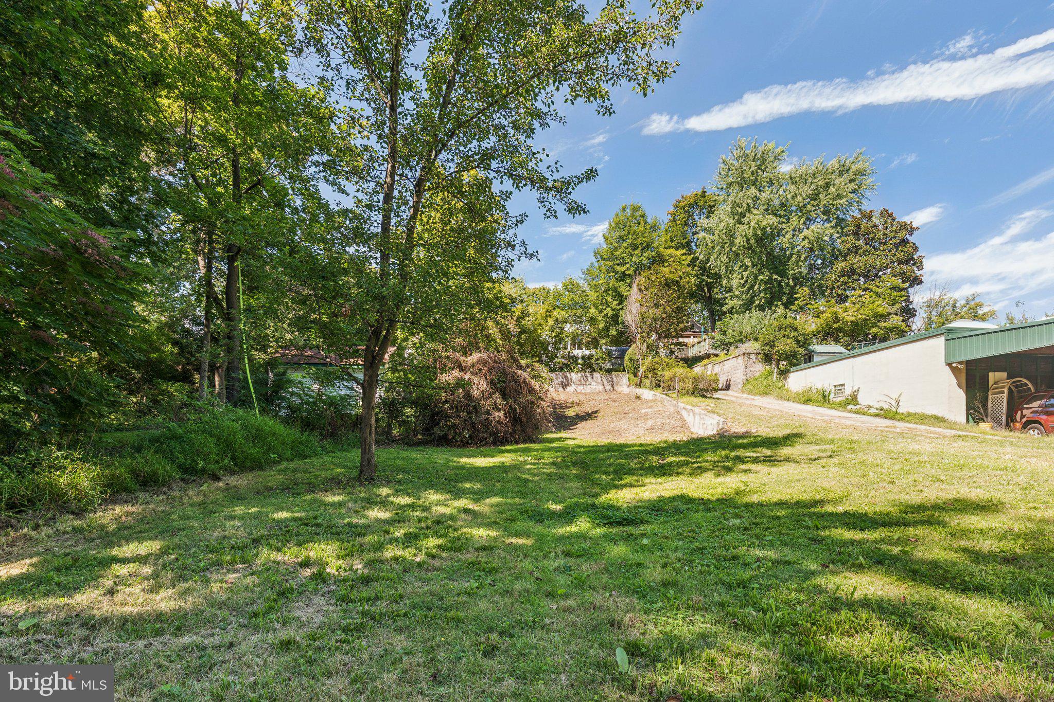375 Church Road Jenkintown, PA 19046 - Photo 68 of 69 a view of a backyard with large trees