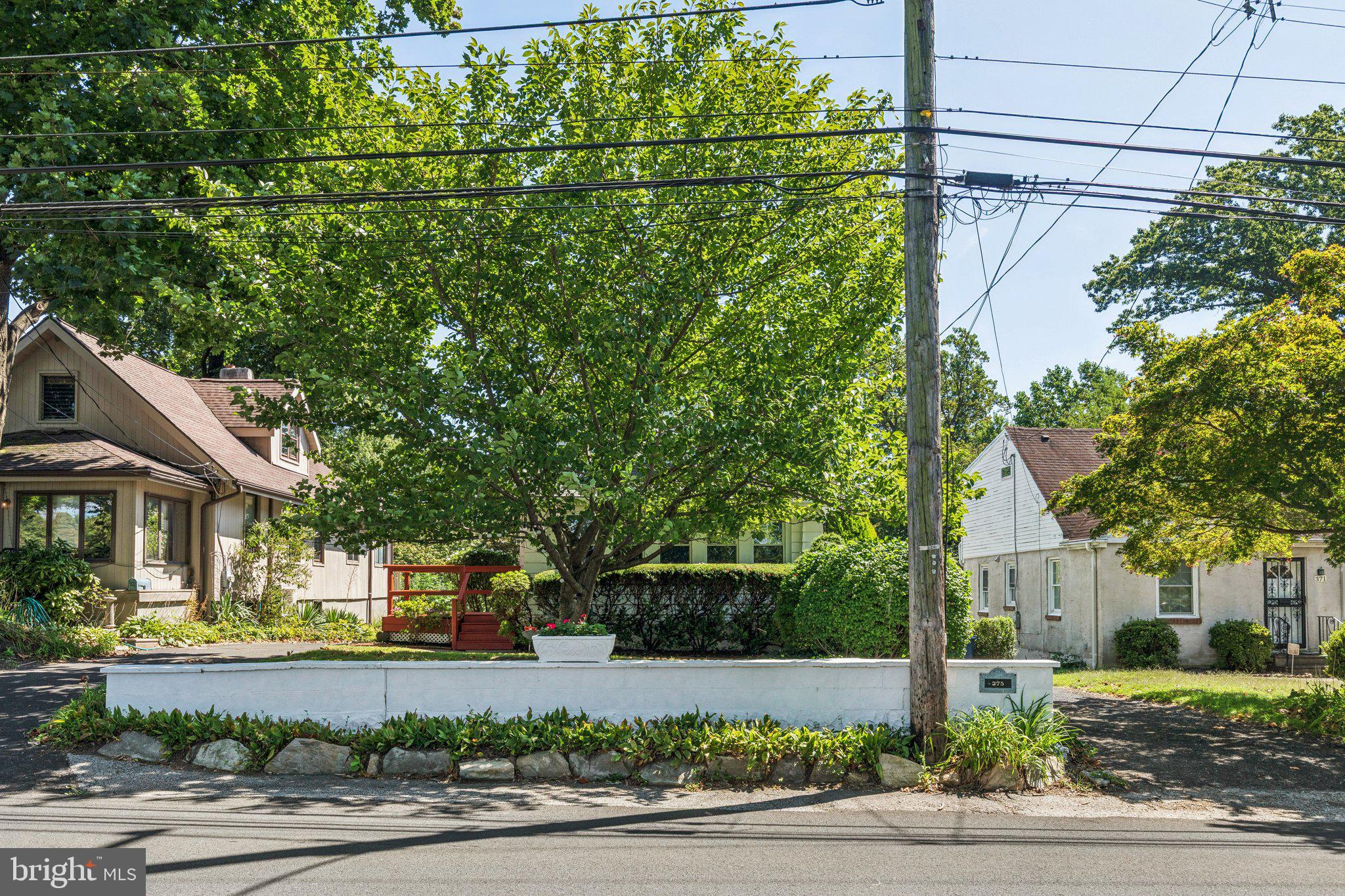 375 Church Road Jenkintown, PA 19046 - Photo 7 of 69 a front view of a house with a garden