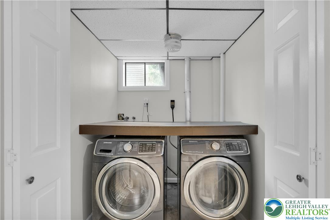 3396 Darien Road Bethlehem, PA 18020 - Photo 37 of 44 A dedicated laundry space provides optimal functionality with front-loading appliances beneath a practical countertop.