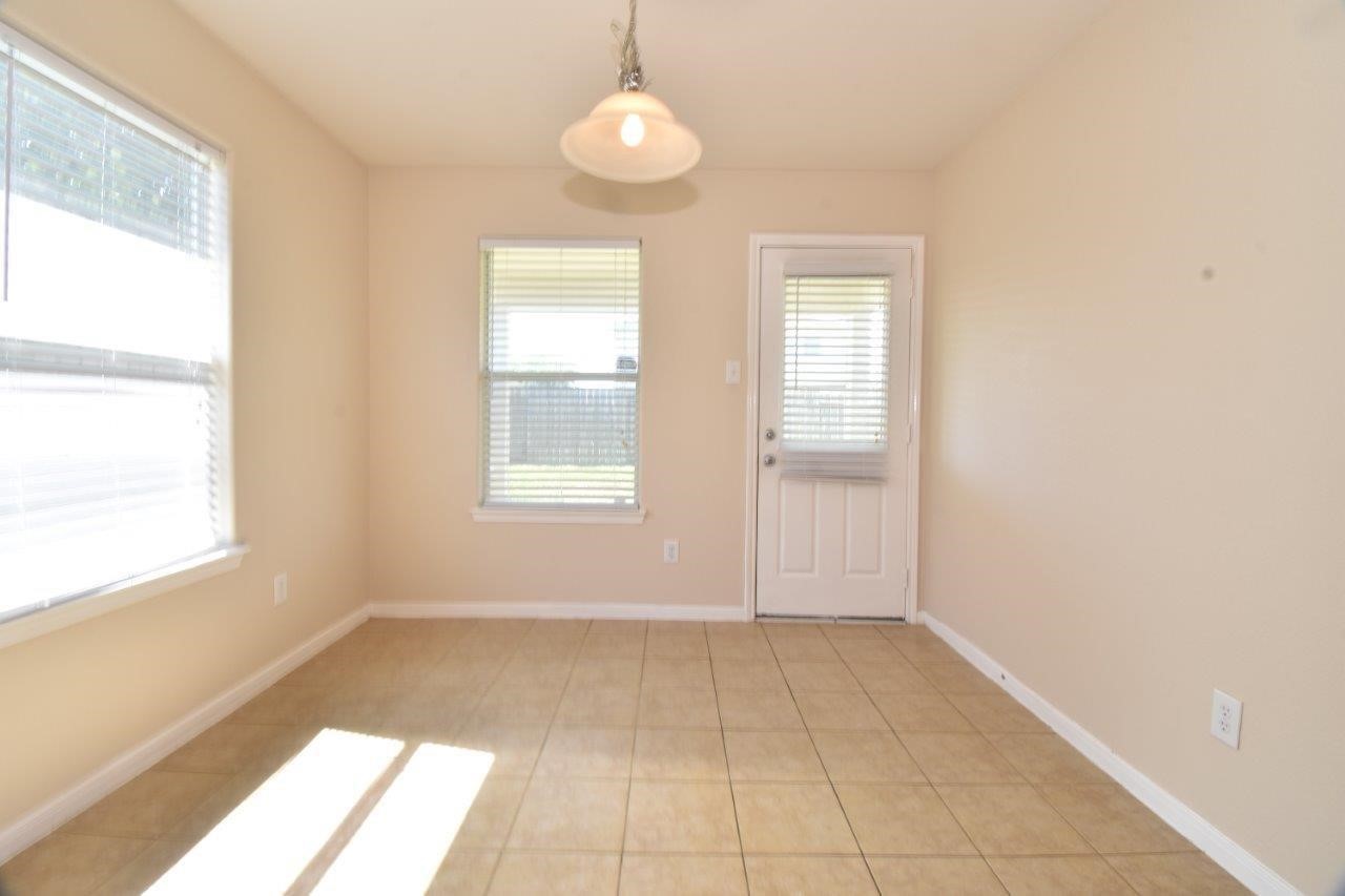 1126 Desert Oasis Lane Rosenberg, TX 77471 - Photo 7 of 16 a view of an empty room with a window
