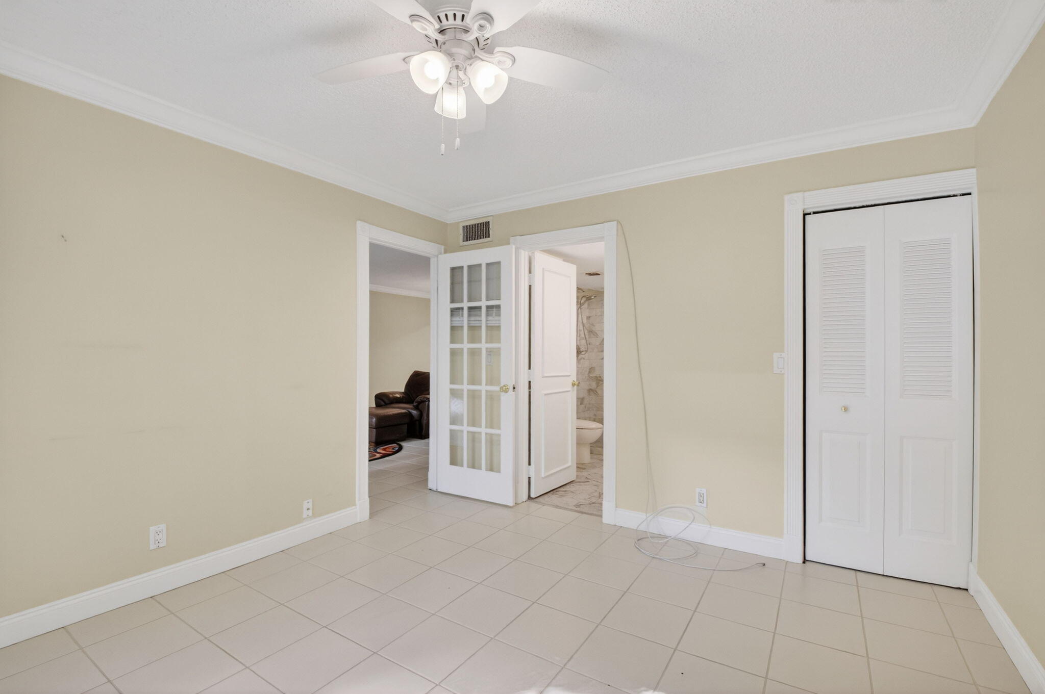 159 Northwest 70th Street, Unit 403 Boca Raton, FL 33487 - Photo 17 of 31 an empty room with closet and windows