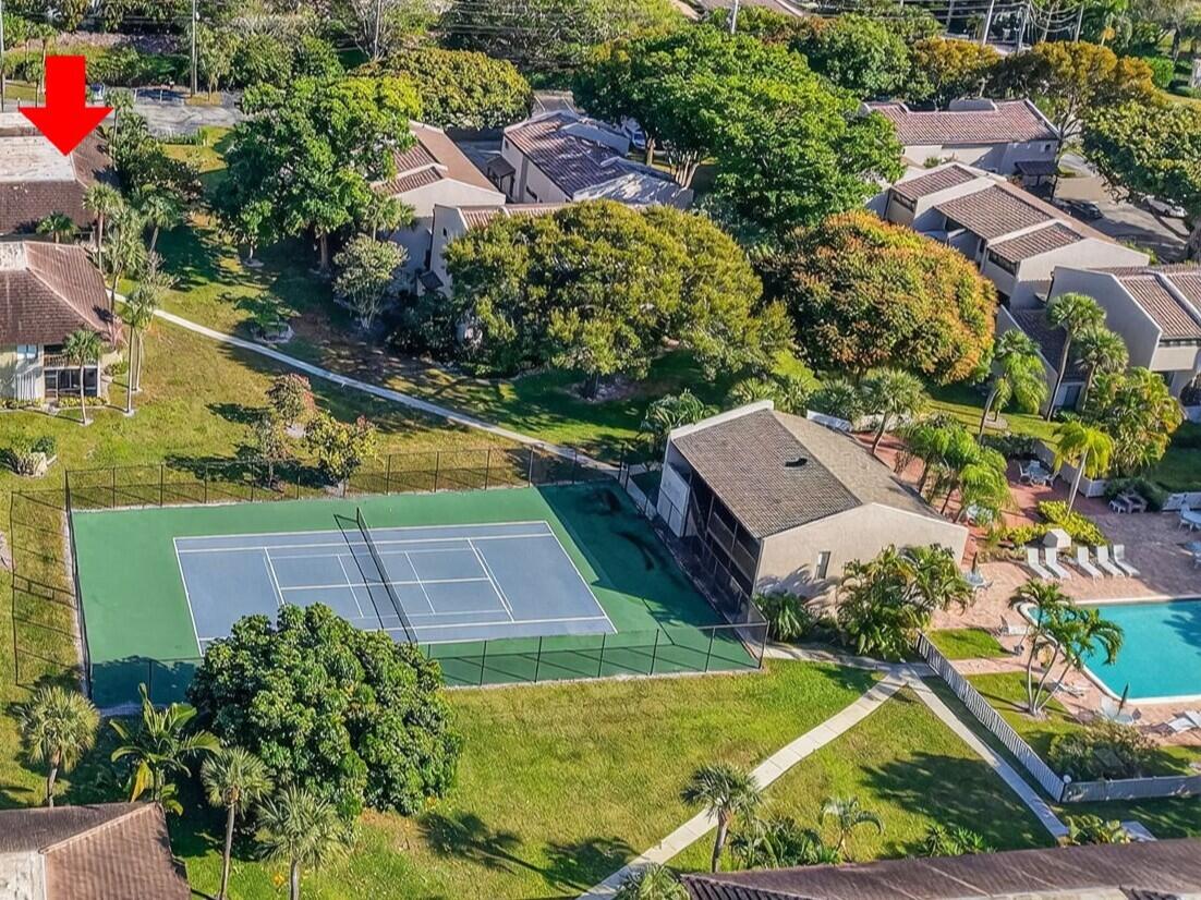 159 Northwest 70th Street, Unit 403 Boca Raton, FL 33487 - Photo 25 of 31 an aerial view of a house with a yard and swimming pool