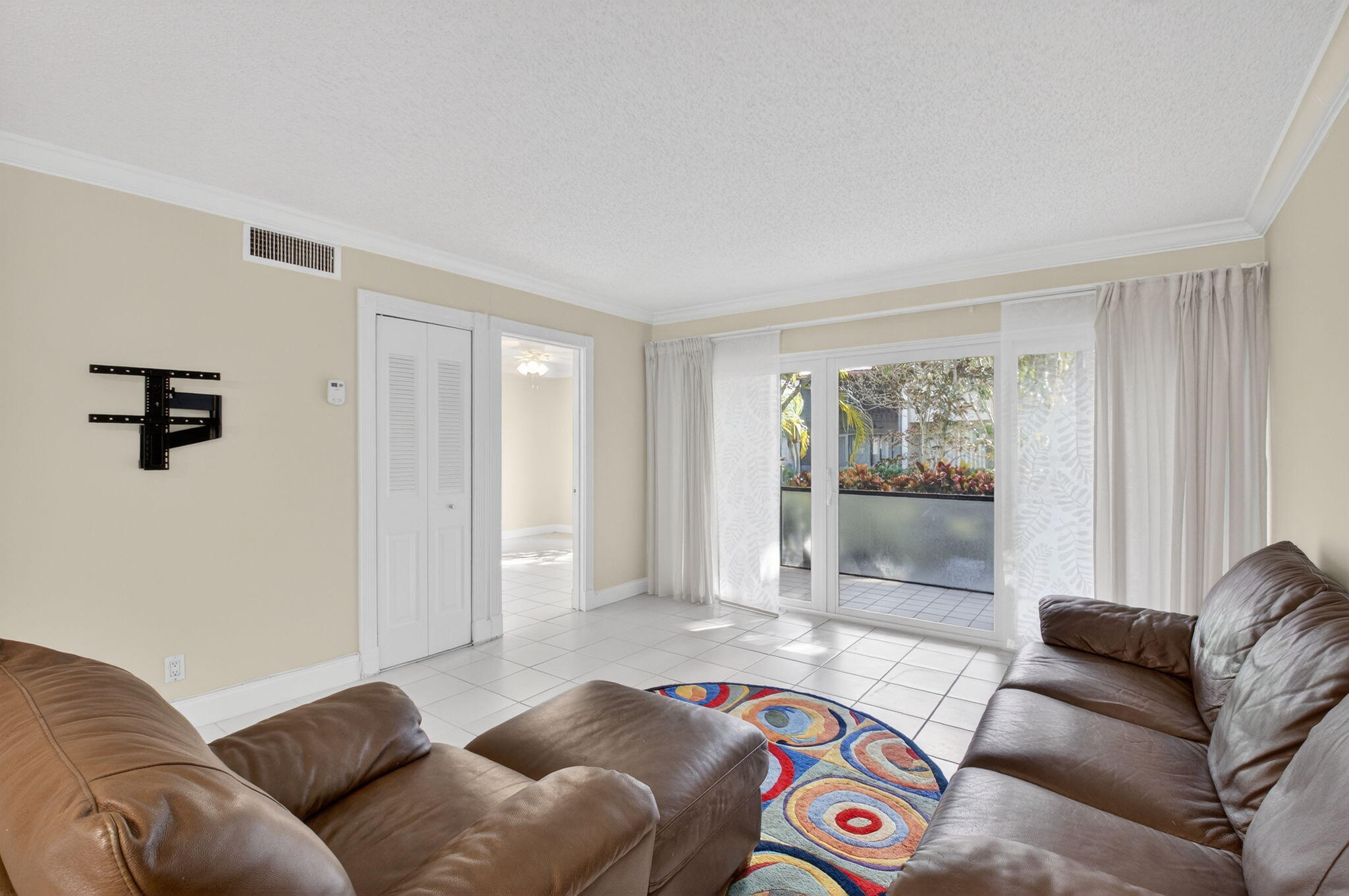 159 Northwest 70th Street, Unit 403 Boca Raton, FL 33487 - Photo 8 of 31 a living room with a couch and a window