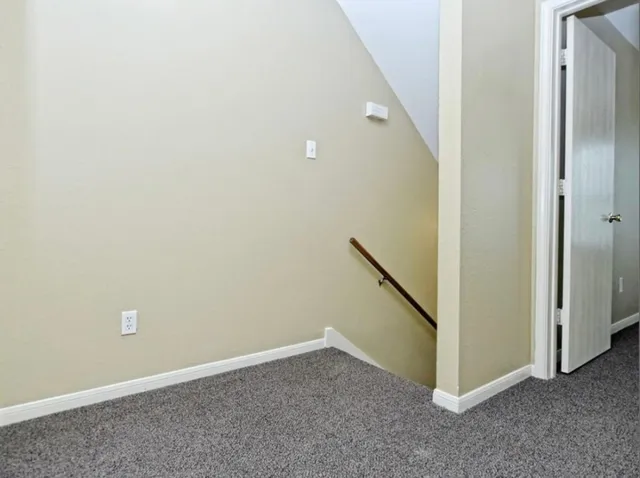 an empty room with a hallway