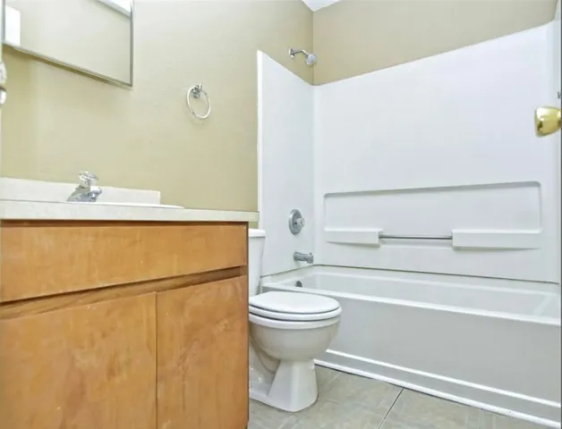 a bathroom with a sink a toilet and a bathtub