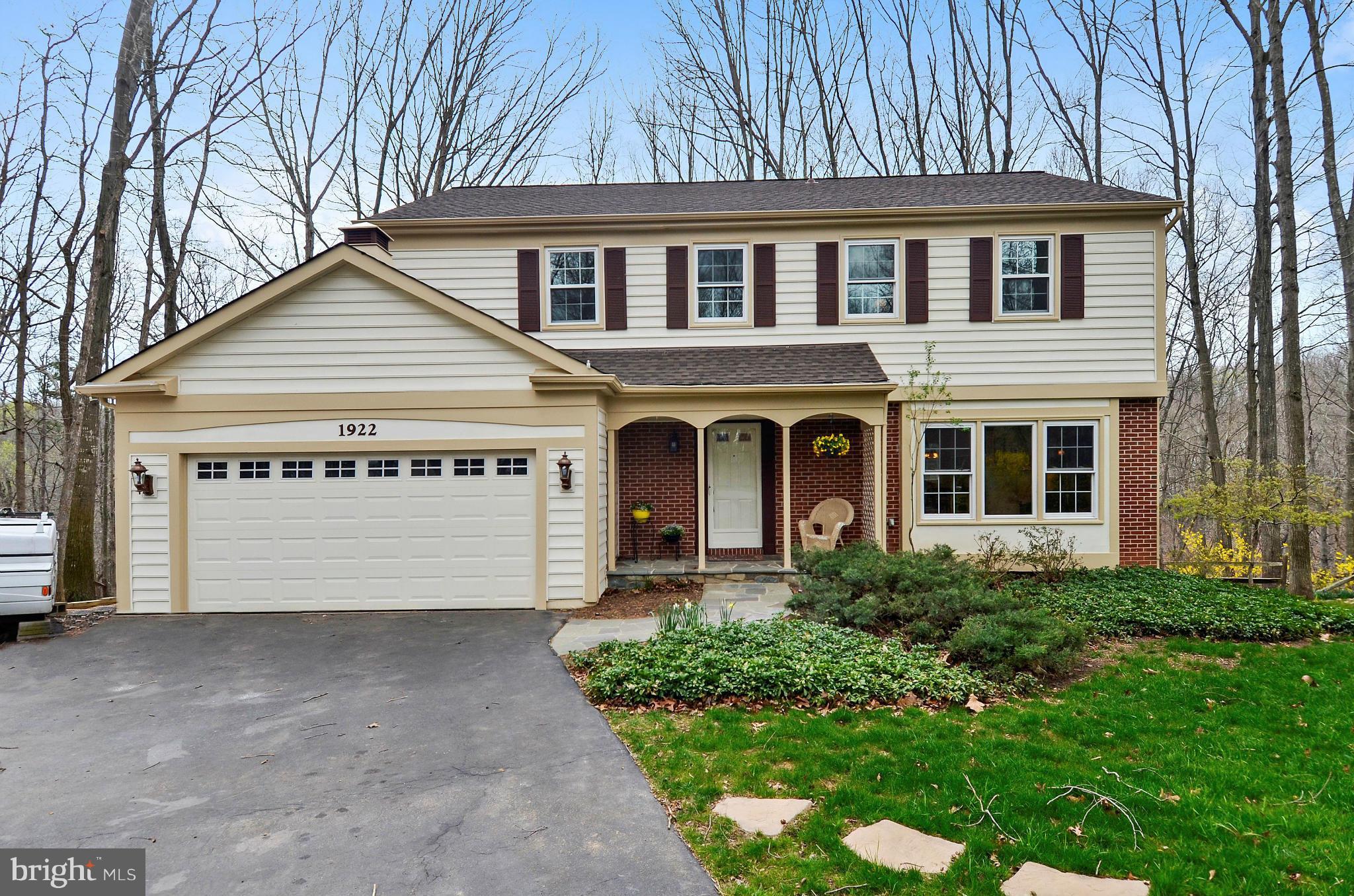 1922 Buckthorn Lane Reston, VA 20191 - Photo 1 of 30 a front view of a house with garden