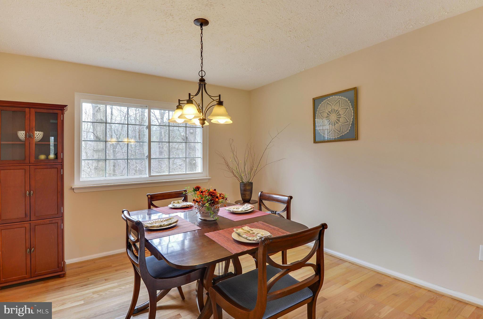 1922 Buckthorn Lane Reston, VA 20191 - Photo 11 of 30 a view of a dining room with furniture window and wooden floor