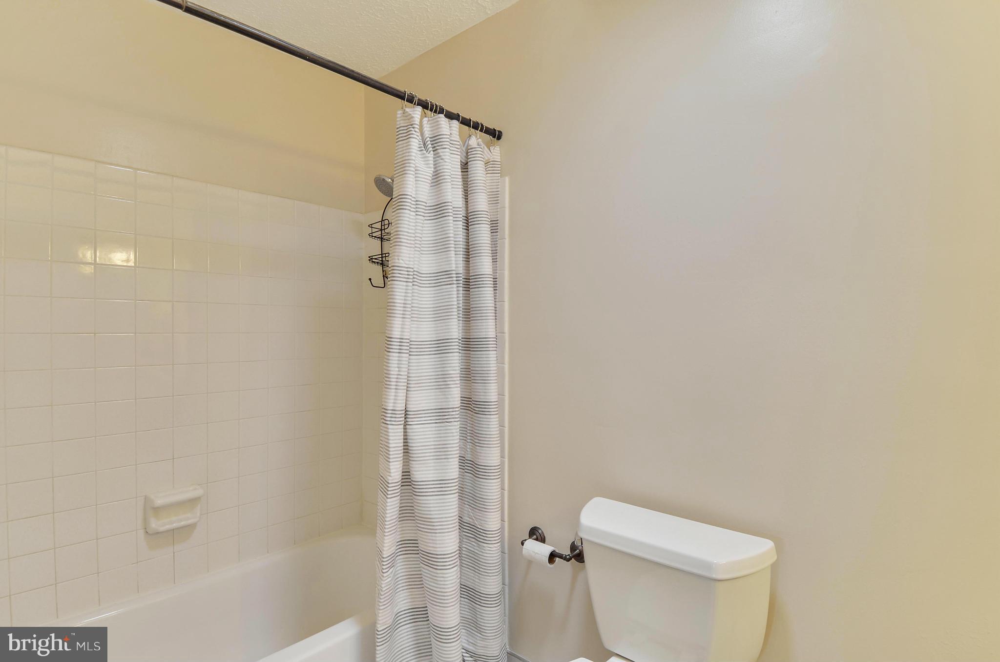 1922 Buckthorn Lane Reston, VA 20191 - Photo 21 of 30 a bathroom with a shower and a toilet