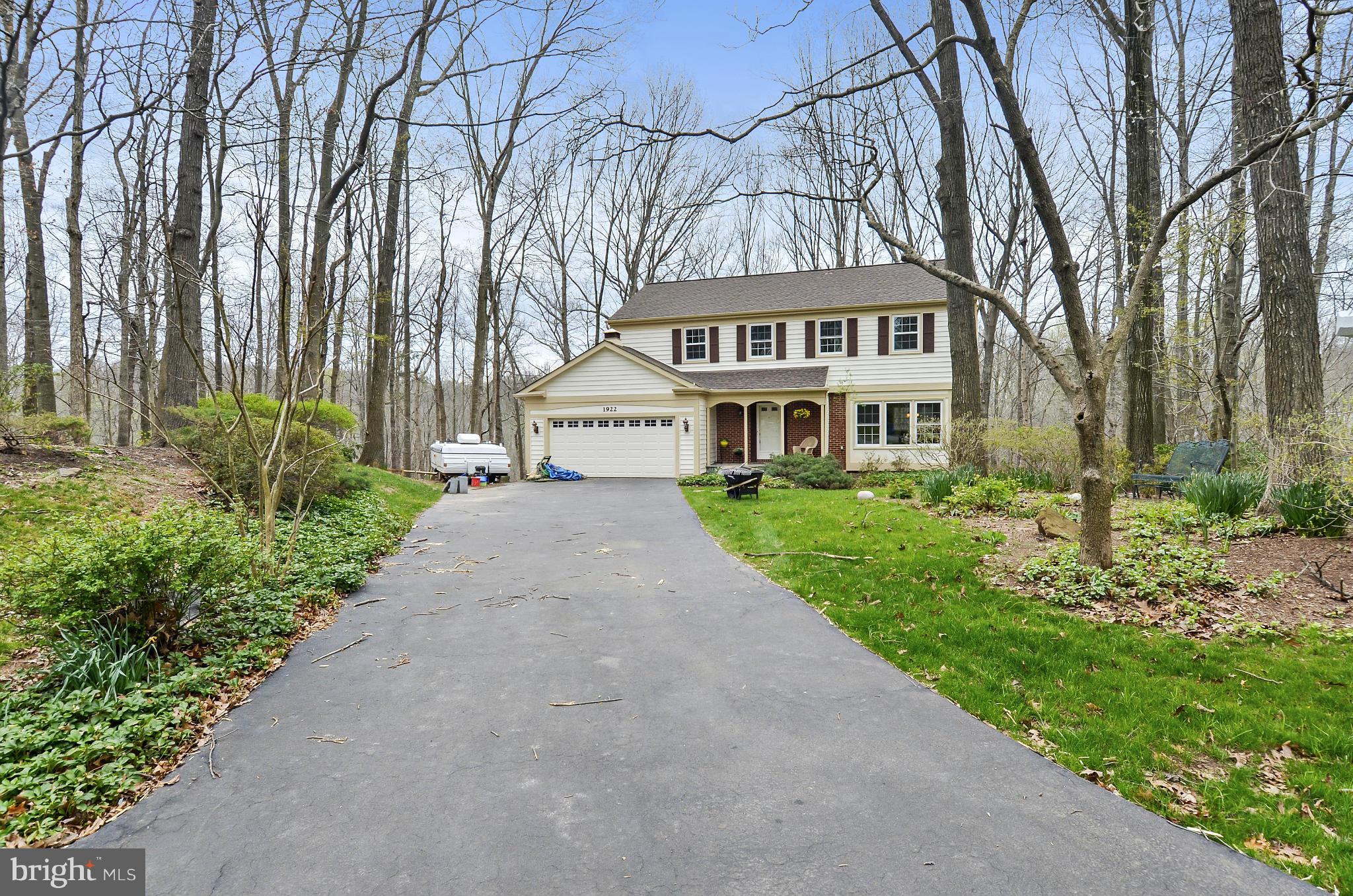 1922 Buckthorn Lane Reston, VA 20191 - Photo 25 of 30 a front view of a house with a garden and trees