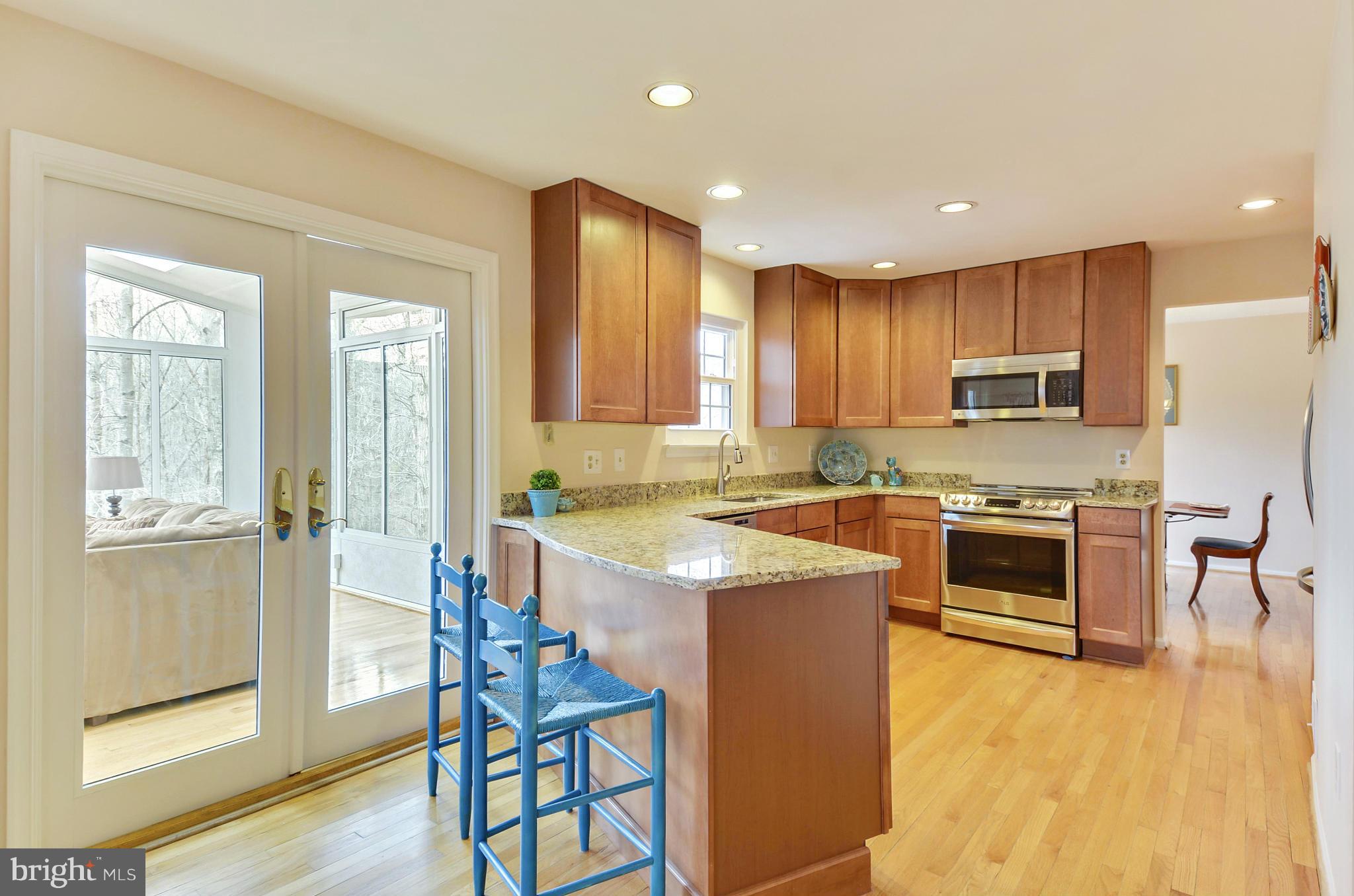 1922 Buckthorn Lane Reston, VA 20191 - Photo 8 of 30 a kitchen with a stove a sink and a refrigerator