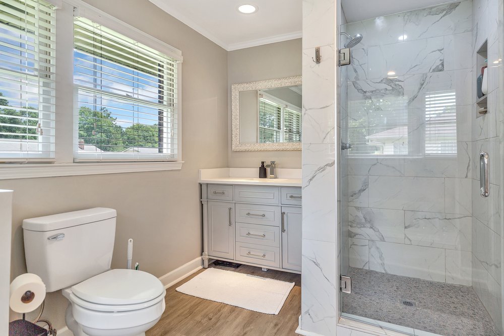 2310 Hannah Road Anderson, SC 29621 - Photo 21 of 32 A well-lit bathroom features a spacious glass-enclosed shower and contemporary vanity.