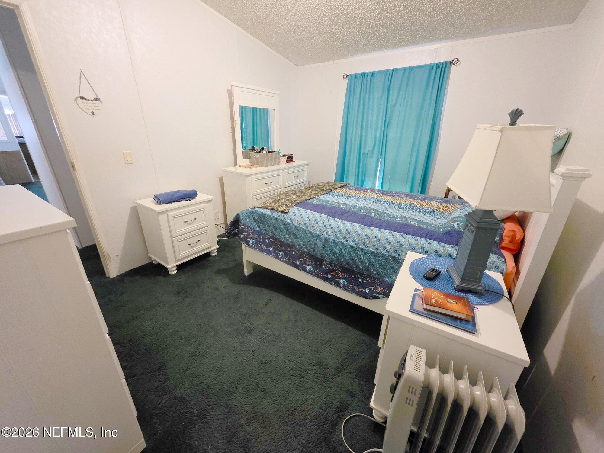 44680 Artesian Boulevard Callahan, FL 32011 - Photo 40 of 47 a bedroom with a bed and a window