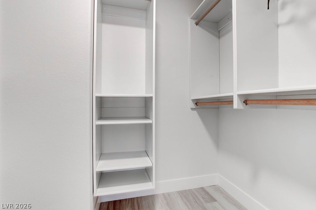 1 Rising Sun Court Henderson, NV 89074 - Photo 31 of 47 Ample shelving and hanging space organize any wardrobe in this walk-in closet.