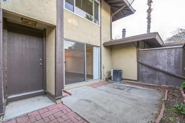 a view of house with outdoor space and swimming pool