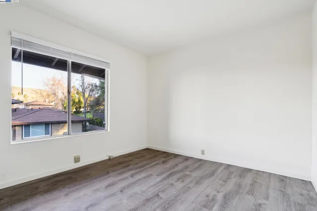 a living room with furniture a rug and a table