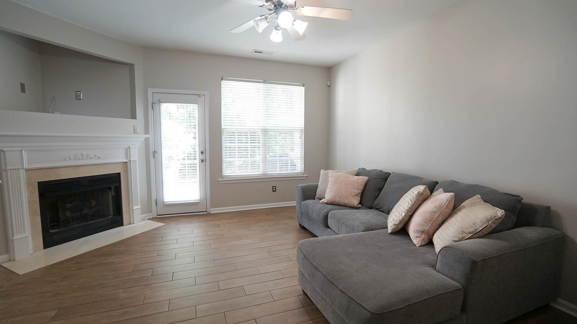 7842 Silverthread Lane Raleigh, NC 27617 - Photo 9 of 26 *Living Room with Gas Log Fireplace*French Door to Back Patio*
