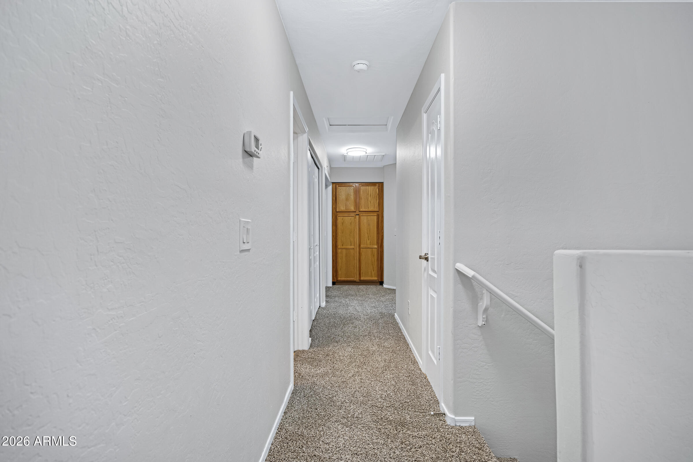 19408 North Braden Road Maricopa, AZ 85138 - Photo 30 of 51 a view of a hallway with wooden floor