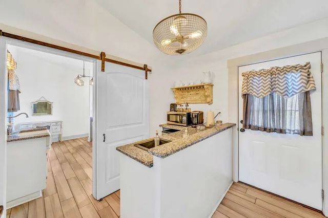 a kitchen with a sink stove and refrigerator