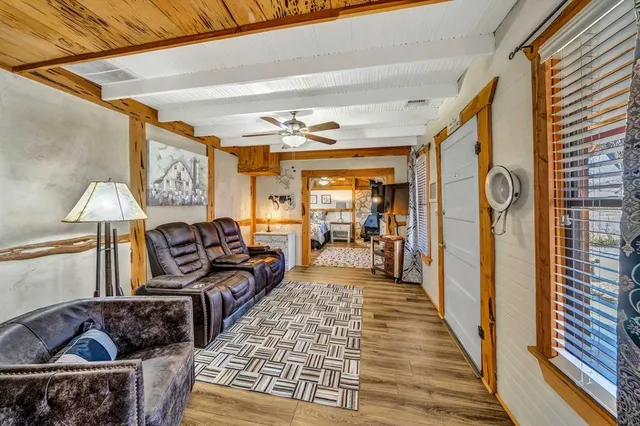 a living room with furniture and a rug