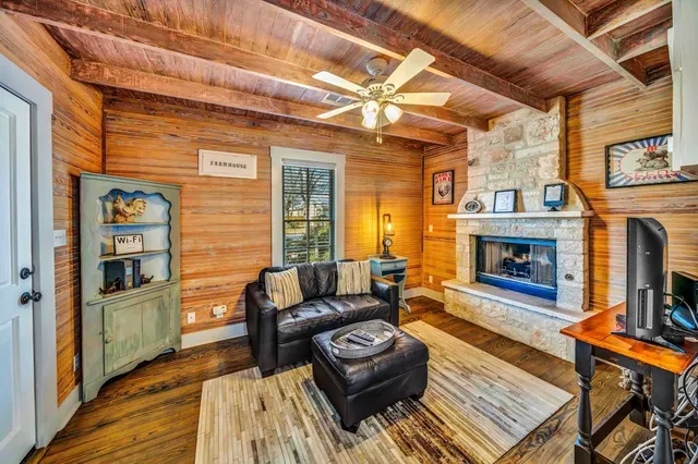 a living room with furniture and a fireplace