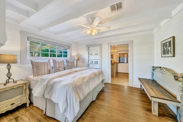 a bed room with a bed and a lamp