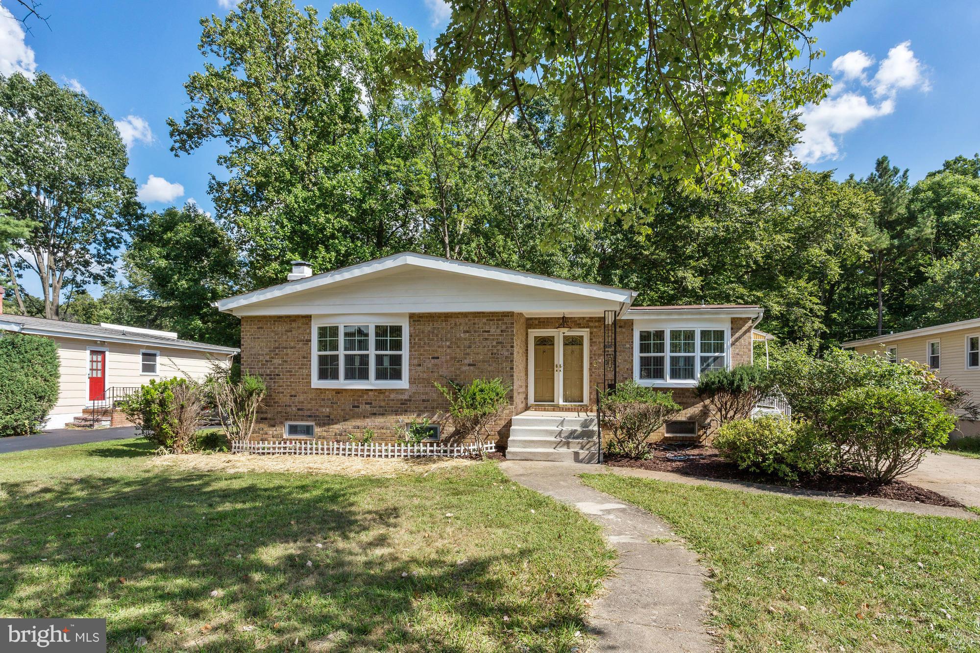 9405 Tulsemere Road Randallstown, MD 21133 - Photo 1 of 26 a front view of house with yard and green space