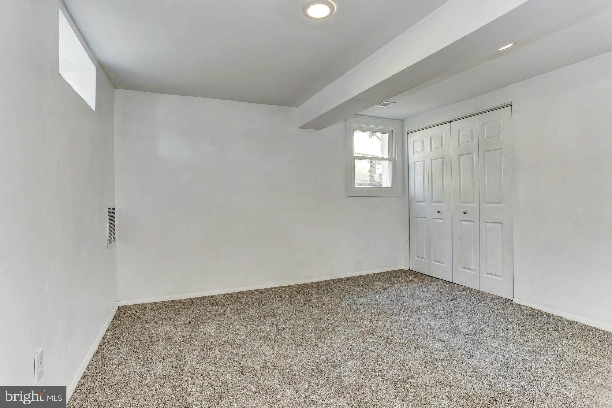 9405 Tulsemere Road Randallstown, MD 21133 - Photo 15 of 26 wooden floor in an empty room
