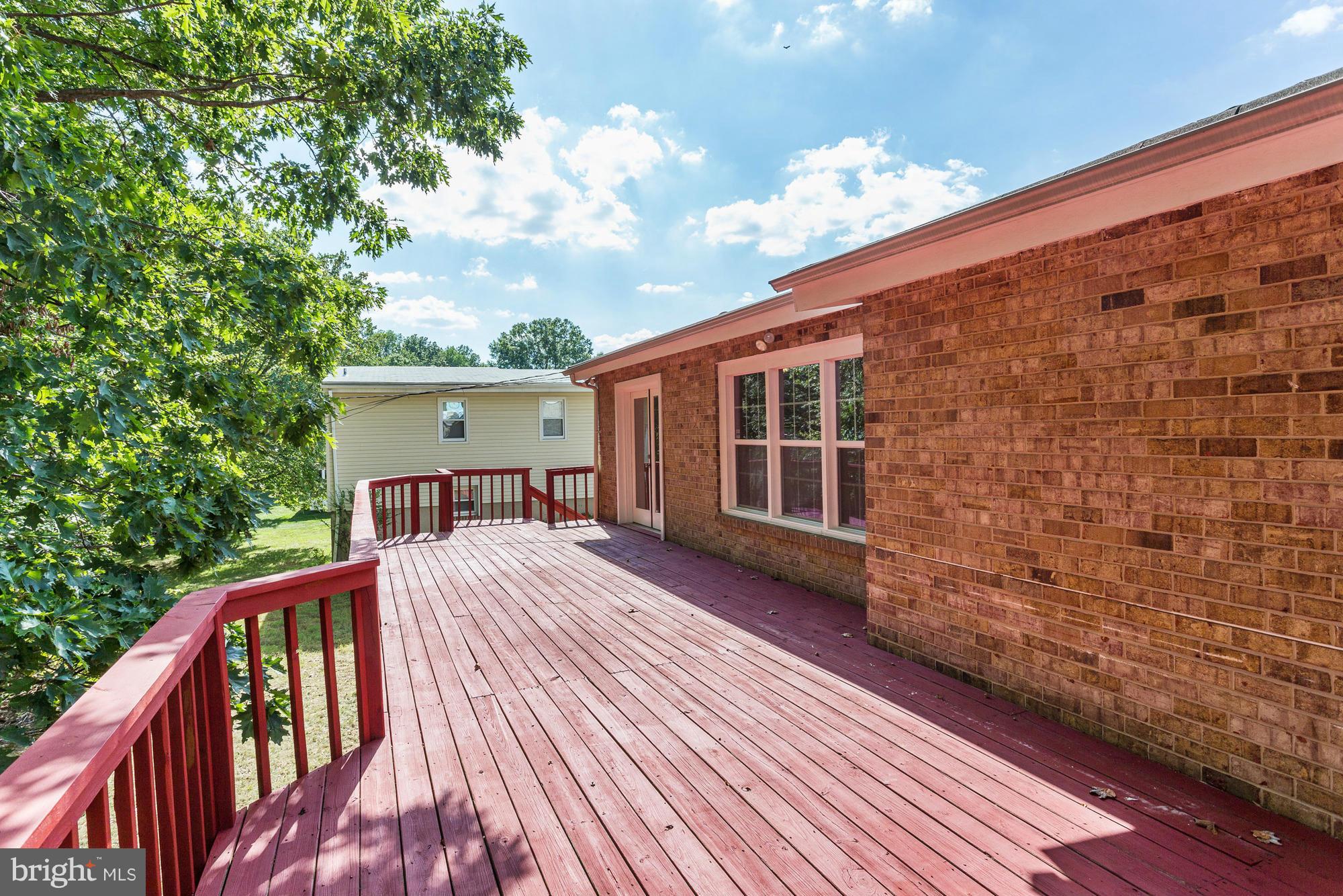 9405 Tulsemere Road Randallstown, MD 21133 - Photo 21 of 26 a view of a house with backyard and sitting area