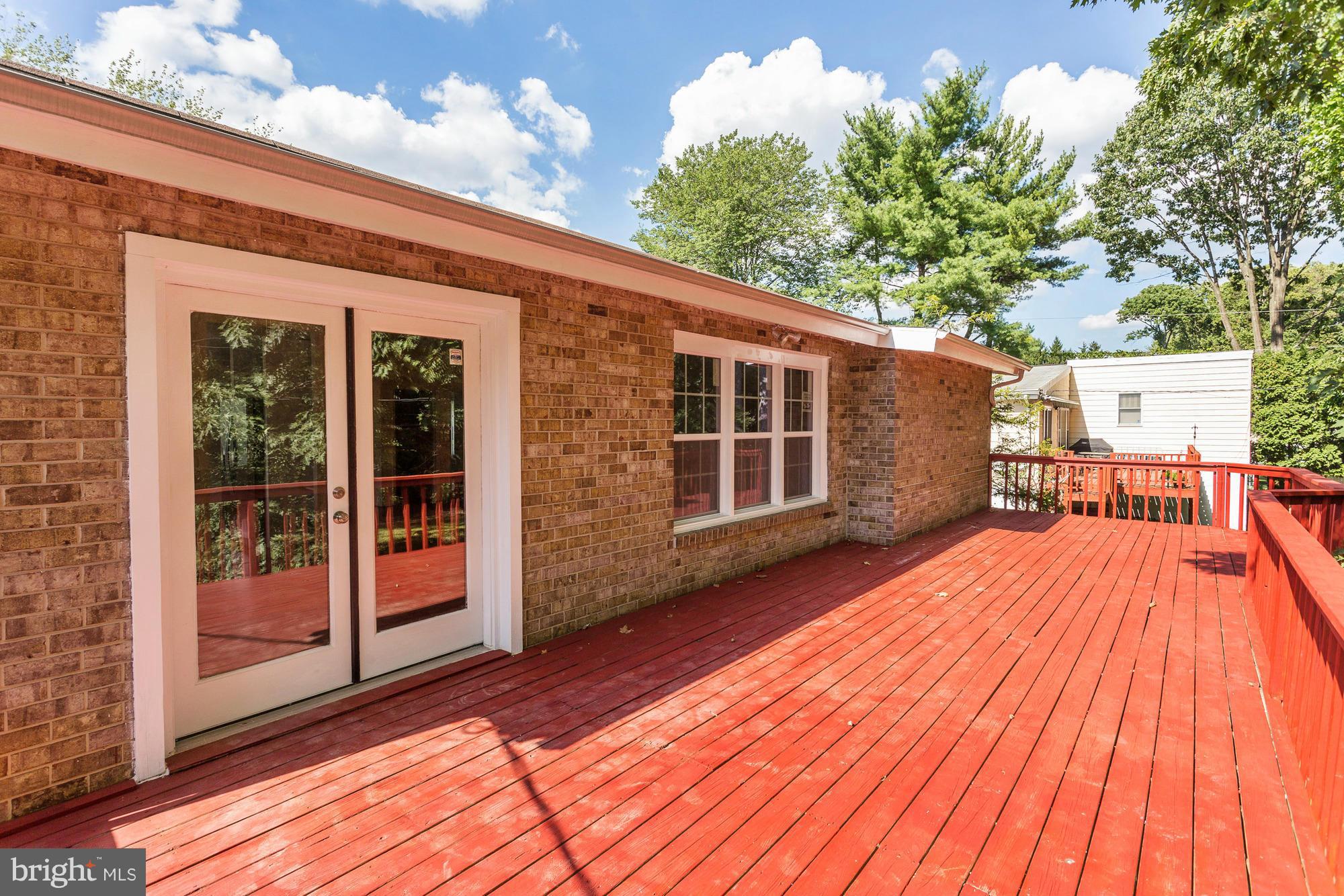 9405 Tulsemere Road Randallstown, MD 21133 - Photo 22 of 26 a view of backyard with a deck and wooden floor