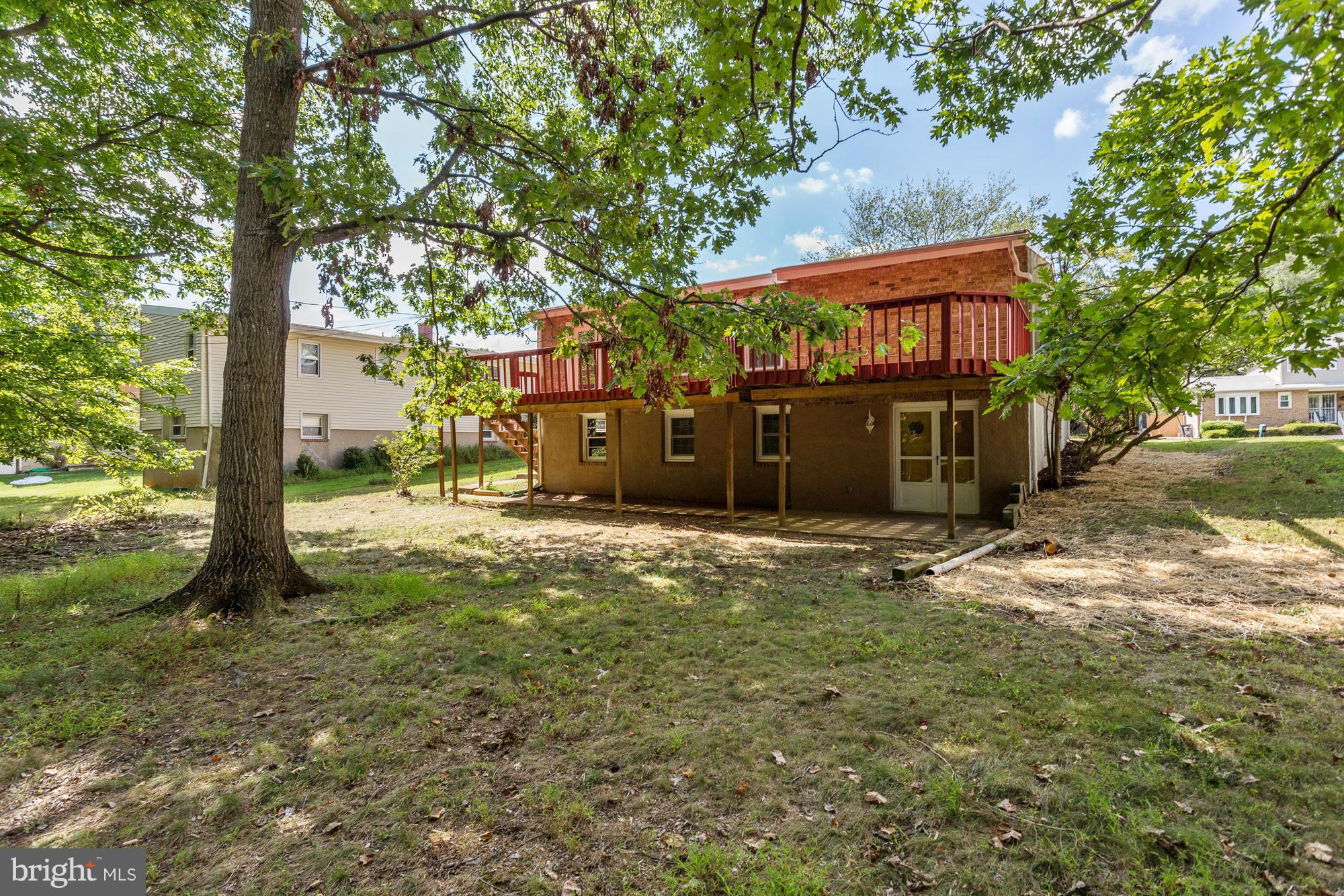 9405 Tulsemere Road Randallstown, MD 21133 - Photo 23 of 26 a view of a house with a yard