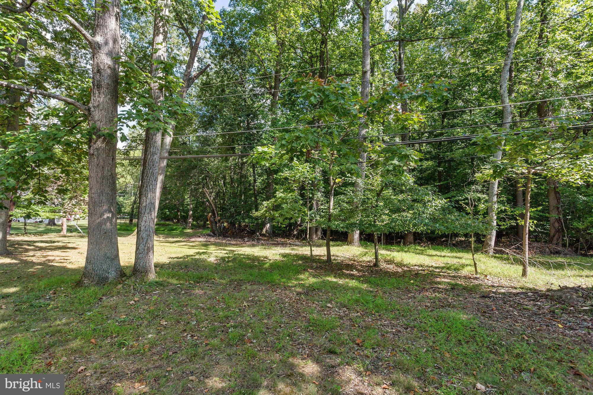 9405 Tulsemere Road Randallstown, MD 21133 - Photo 24 of 26 a view of outdoor space with deck and yard