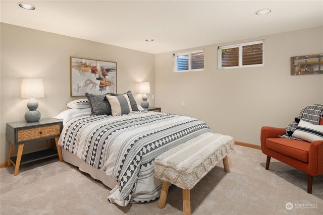 a bedroom with a bed and chair