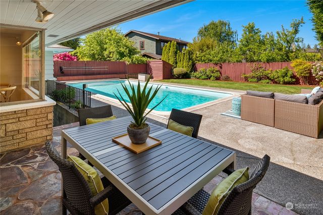 a front view of house with a garden and patio