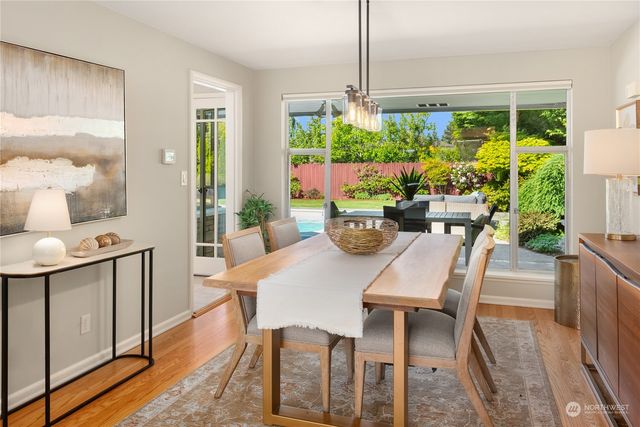 a view of a dining room with furniture window and outside view