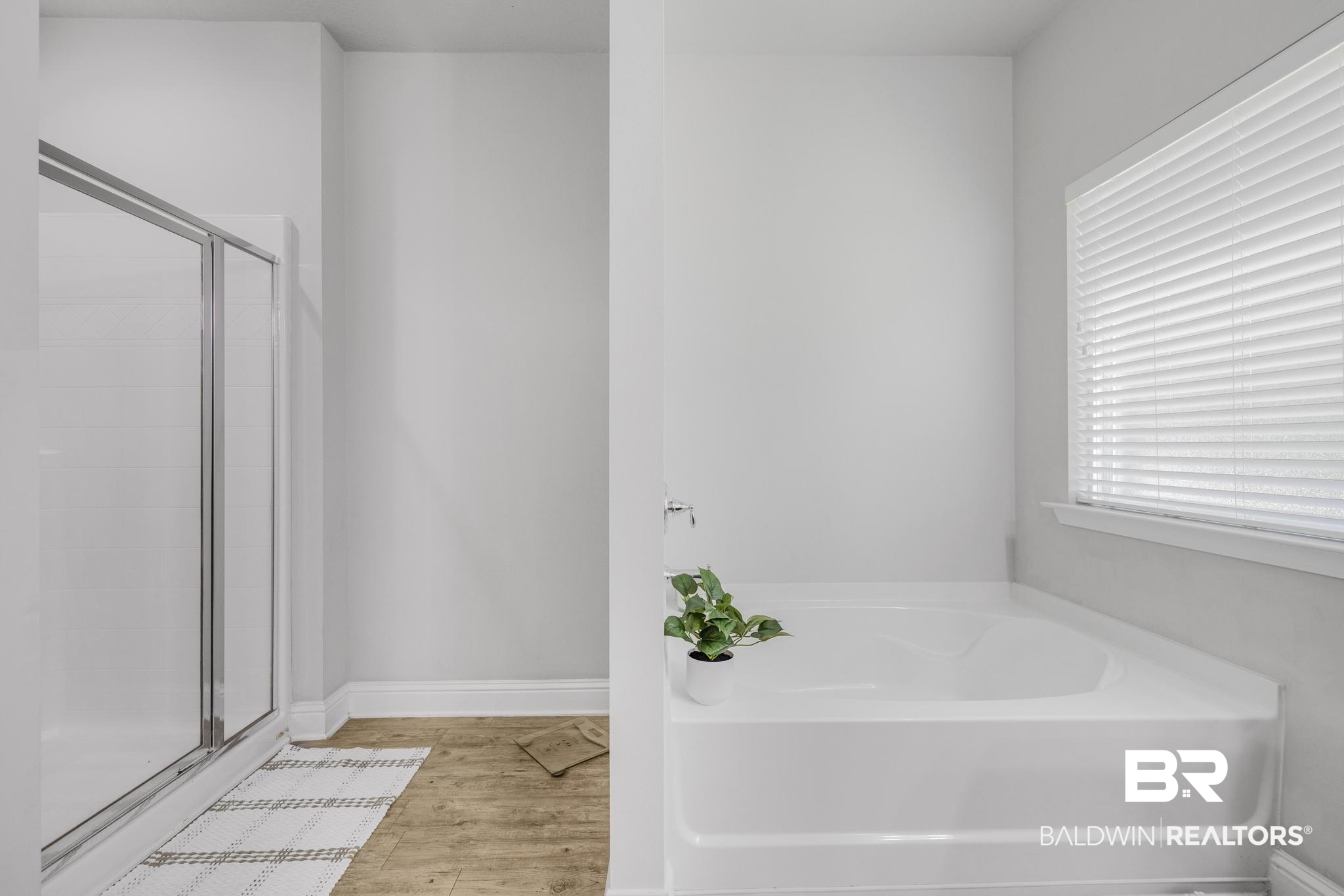 31336 Hoot Owl Road Daphne, AL 36527 - Photo 13 of 36 Full bath featuring a garden tub, a stall shower, and light wood-style floors