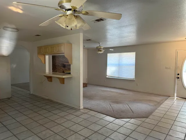 a kitchen with a sink a stove and refrigerator