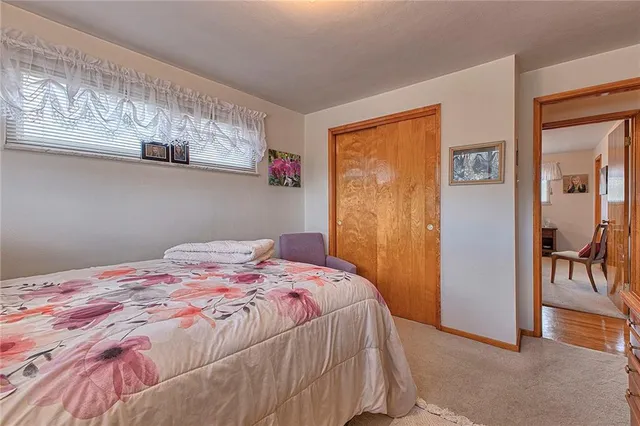 a bedroom with a bed and a table in it