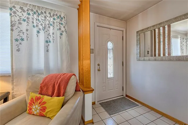 a living room with furniture and a bathtub
