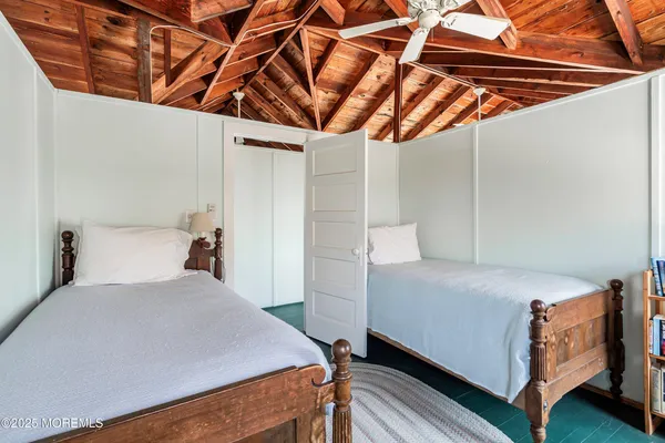 a bedroom with a bed and a shower