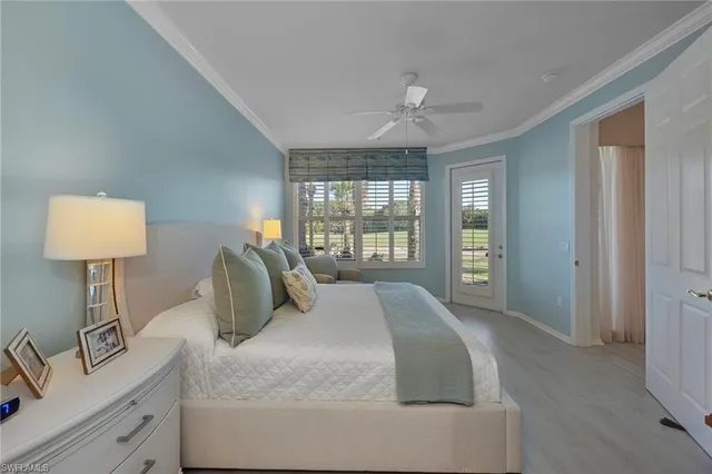 a spacious bedroom with a bed and a window