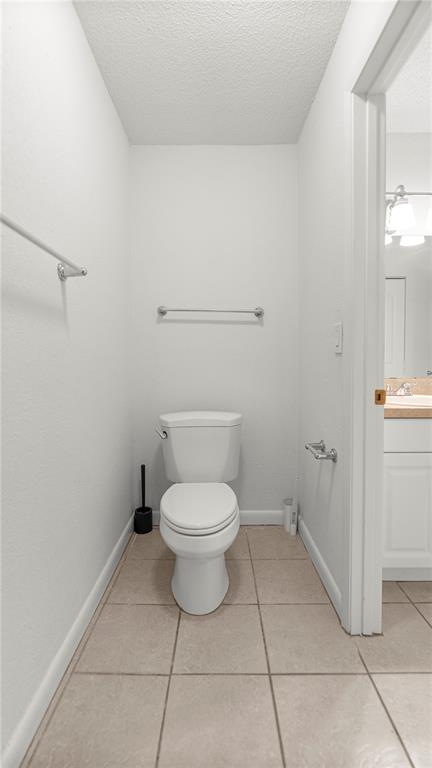 501 Southwest 75th Street, Unit B5 Gainesville, FL 32607 - Photo 18 of 38 a bathroom with a toilet and a vanity