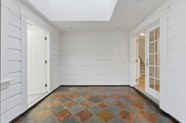 a view of a room with white walls