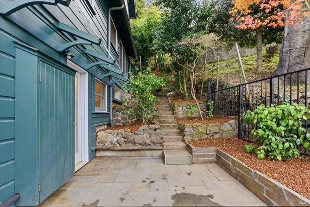 a view of a couches in backyard of house