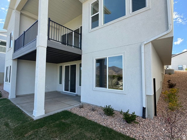 624 North Legend Circle, Unit 480 Mapleton, UT 84664 - Photo 29 of 34 View of side of home with a patio, stucco siding, and a balcony