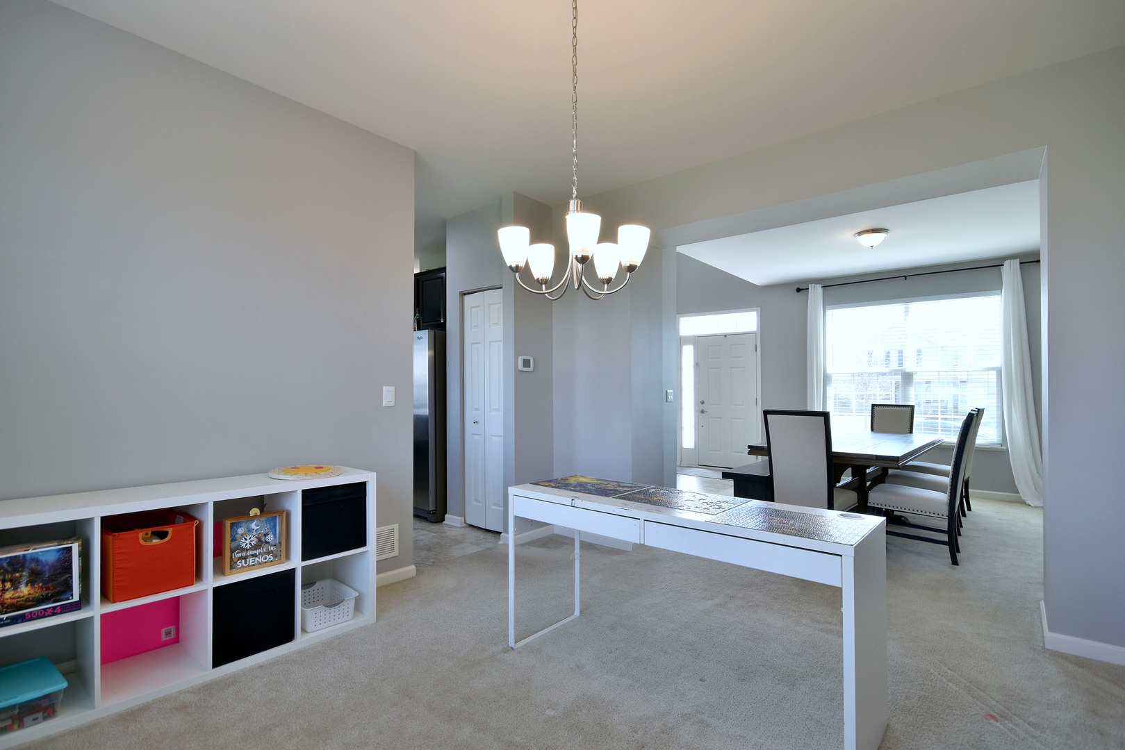 168 Reston Lane Gilberts, IL 60136 - Photo 12 of 43 a living room with furniture a table and a large mirror