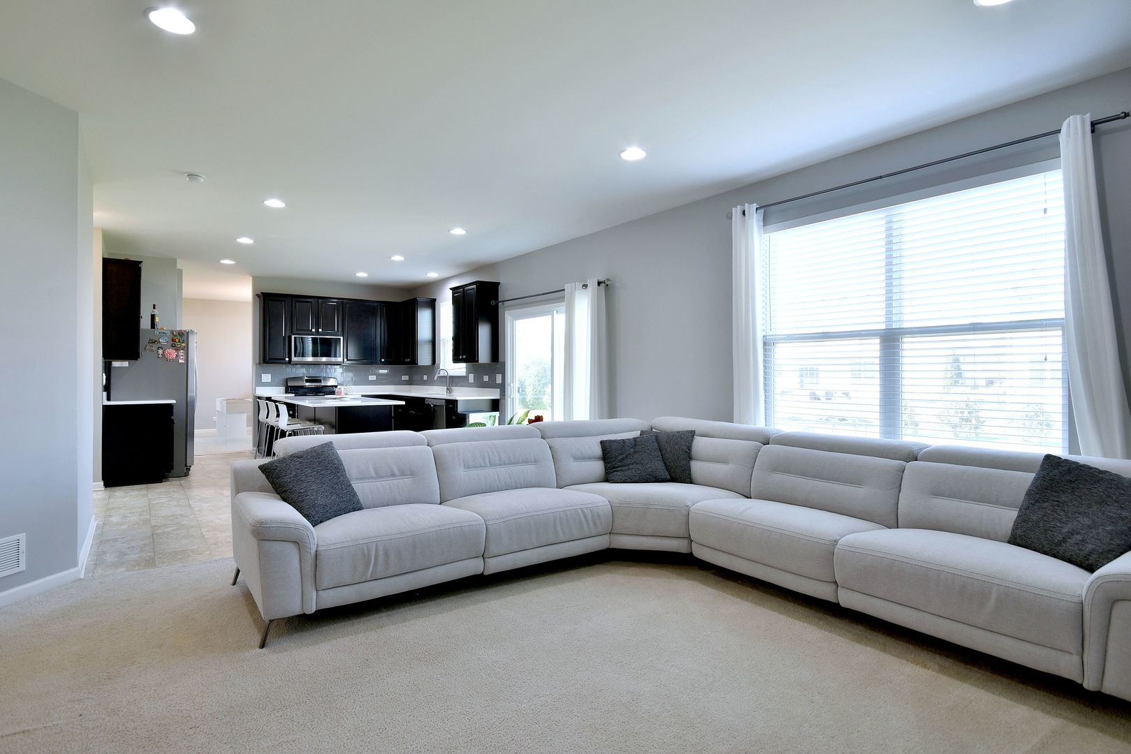 168 Reston Lane Gilberts, IL 60136 - Photo 20 of 43 a living room with furniture and a large window