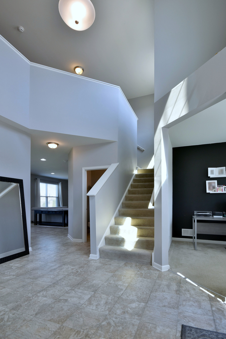 168 Reston Lane Gilberts, IL 60136 - Photo 3 of 43 a view of a hallway view with staircase