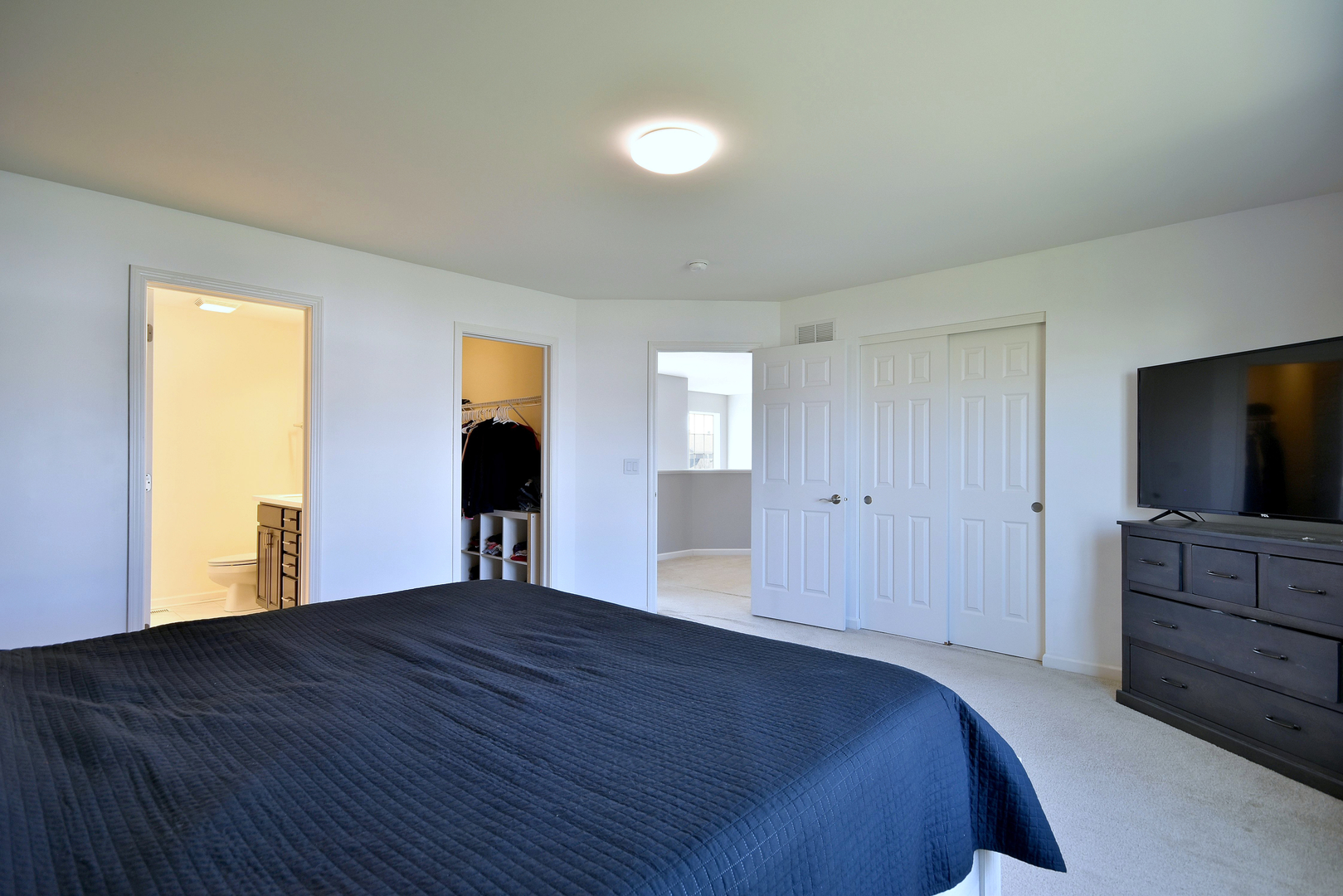 168 Reston Lane Gilberts, IL 60136 - Photo 32 of 43 a bedroom with a bed and a flat screen tv