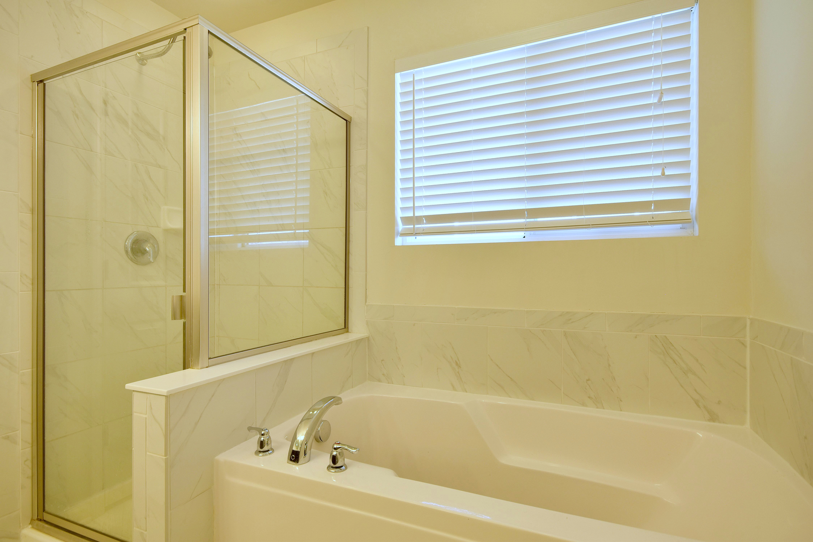 168 Reston Lane Gilberts, IL 60136 - Photo 35 of 43 a bathroom with a bathtub and a shower